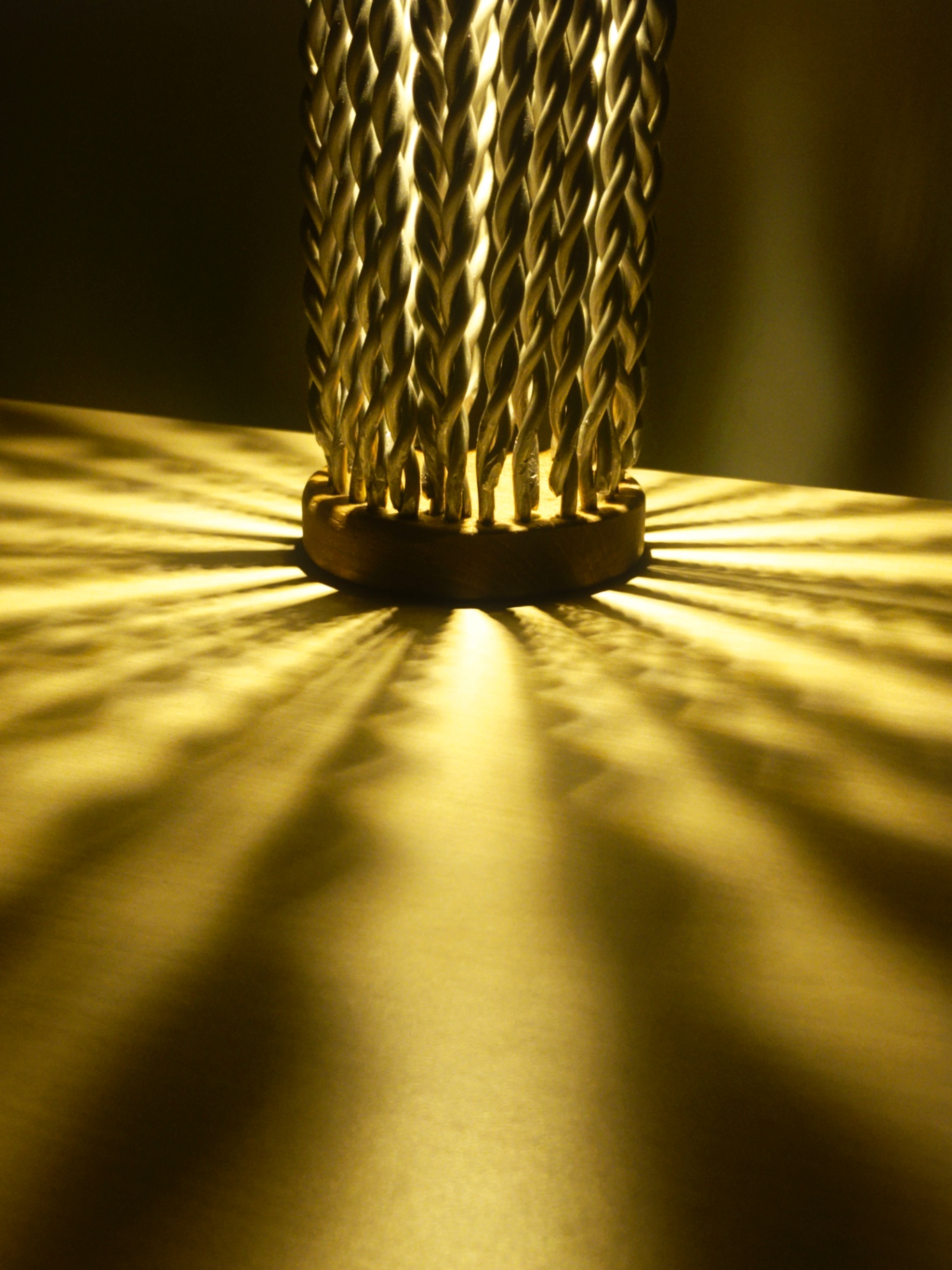 Radial shadows projected from the base of the lamp